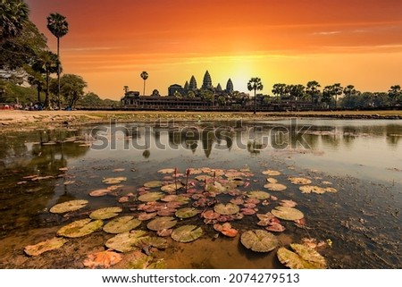 Sunrise view of popular tourist attraction ancient temple complex Angkor Wat with reflected in lake Siem Reap, Cambodia