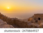 Sunrise view of the ruins of the Masada Fortress and the Dead Sea, Judaean Desert, southern Israel