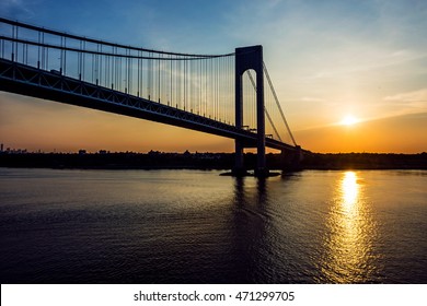 A sunrise view of the Verrazano Narrows Bridge in the New York Harbor.