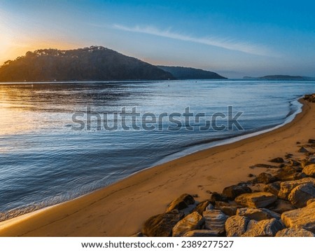 Sunrise waterscape at the channel in Ettalong Beach on the Central Coast, NSW, Australia.