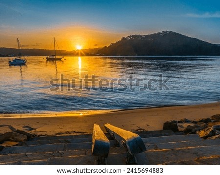 Sunrise waterscape at the channel in Ettalong Beach on the Central Coast, NSW, Australia.