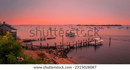 Sunrise and wildfire smoke over the Atlantic Ocean at Noank Marina in Connecticut
