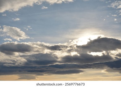 The sun's rays break through the clouds