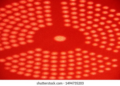 the sun's rays cast a disk shadow of circles. abstract shadows dots on a red background. seamless pattern of dots in white shades with polka dots shadows on red tone.