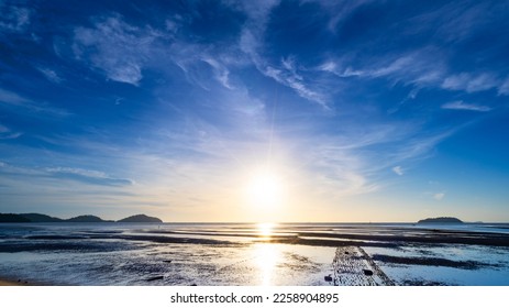 The sun's rays over the sea beautiful clouds with the setting sun over the sea,clear sea horizon over blue sky with sun shine,Nature environment sky background - Powered by Shutterstock