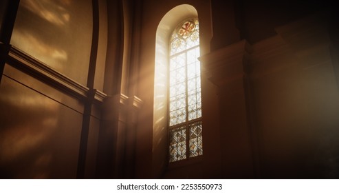 The Sun's Rays Streaming Through Stained Glass Windows of The Cathedral, Blessing The Church With A Heavenly Light that Enters House Of The Lord. A Reminder Of God's Love And Grace. Cinematic Concept - Shutterstock ID 2253550973