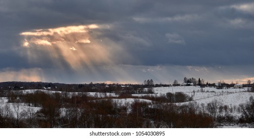 The sun's rays through the clouds