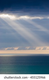 The sun's rays through the clouds in the sky on the peninsula Jandia. Fuerteventura. Canary Islands. Spain