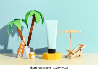 Sunscreen Ad Template, Sunblock Tube Mockup On Podium, Decorated With Miniature Beach Chair, Palm Tree And Umbrella. Blue Background