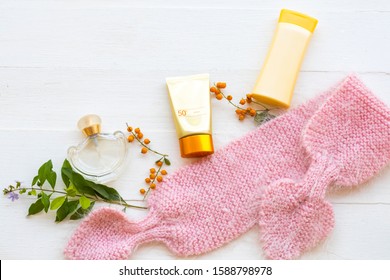 Sunscreen ,body Lotion ,perfume  ,knitting Wool Scarf Of Beauty Health Care Of Lifestyle Woman Relax In Winter Season Arrangemenat Flat Lay Style On Background White 
