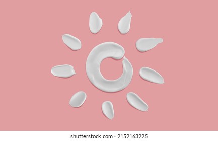 Sunscreen cream sun shape smears on pink background, white moisturiser strokes