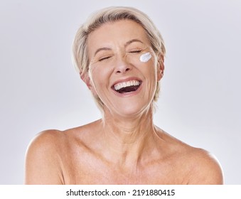 Sunscreen, lotion and moisturizing senior woman with face cream on skin isolated on studio background. Beauty, fresh and aging lady with wrinkles applying moisturizer for selfcare or skincare - Powered by Shutterstock