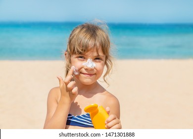Sunscreen on the skin of a child. Selective focus.