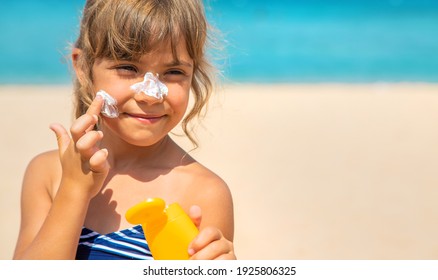 Sunscreen On The Skin Of A Child. Selective Focus. Nature.