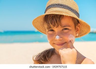Sunscreen On The Skin Of A Child. Selective Focus. Nature.