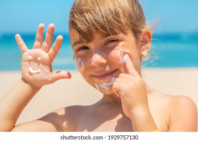 Sunscreen On The Skin Of A Child. Selective Focus. Nature.