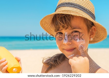 Sunscreen on the skin of a child. Selective focus. nature.