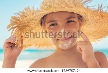 Sunscreen on the skin of a child. Selective focus. nature.