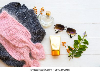 Sunscreen ,perfume ,sunglasses ,knitting Wool Scarf And Sweater Of Beauty Health Care Of Lifestyle Woman Relax In Winter Season Arrangemenat Flat Lay Style On Background White 