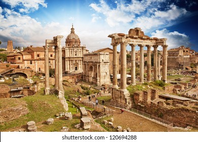Sunset above Ancient Ruins of Rome - Imperial Forum - Italy