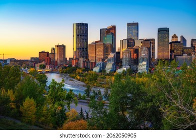 Sunset Above City Skyline Of Calgary With Bow River, Alberta, Canada.