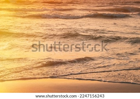 Similar – Image, Stock Photo Sunset above sea. Riplpe sea ocean water surface with small waves. Ocean water foam splash washing sandy beach