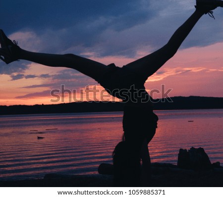 Sunset acrobatic girl