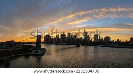 Sunset afterglow of the Brooklyn Bridge and New York City skyline at New York