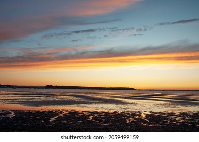 Sunset Along The Coast In Sandbanks.