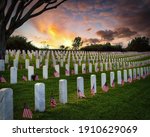 Sunset and American flags on Memorial Day at a national cemetery in southern California.