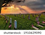 Sunset and American flags on Memorial Day at a national cemetery in southern California.