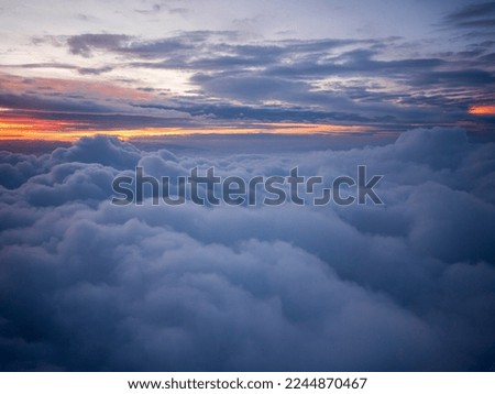 sunset among the clouds in the sky, fantastic and peaceful nature view among the clouds