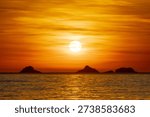 Sunset at Arpoador Beach in Rio de Janeiro, Brazil.