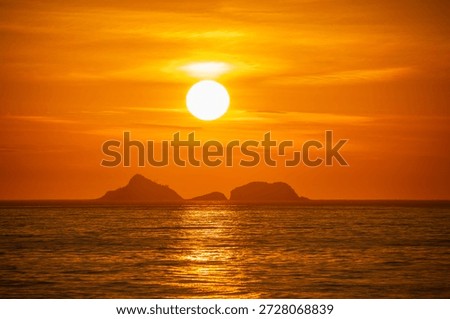 Sunset at Arpoador Beach in Rio de Janeiro, Brazil.