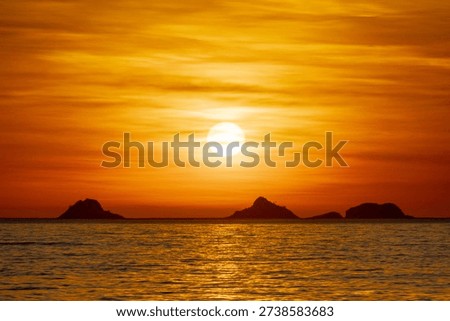 Sunset at Arpoador Beach in Rio de Janeiro, Brazil.