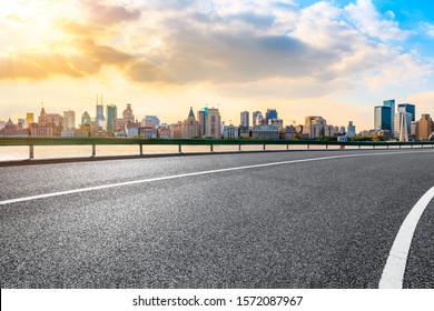 Sunset Asphalt Road And City Skyline In Shanghai