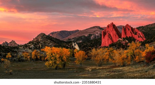 Sunset in the autumn mountains. Autumn mountain landscape in evening. Autumn mountains at sunset. Sunset autumn mountain panorama