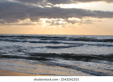 sunset, Baltic Sea, Curonian Spit, breakwaters, driftwood, waves, sunset sky, seascape, sea, coast, sun rays, evening light, clouds at sunset, romance of the sea, nature, tranquility, reflection of th - Powered by Shutterstock