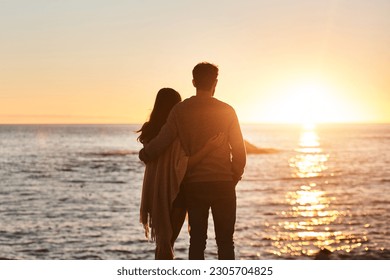 Sunset, beach and back of couple hug in evening on holiday, summer vacation and weekend by ocean. Nature, love and man and woman embrace, hugging and relax for bonding, quality time and peace by sea