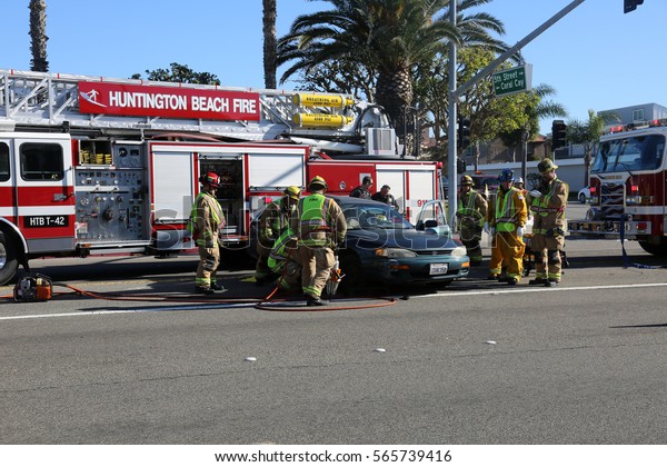 Sunset\
Beach, California - JANUARY 27, 2017: Sunset Beach- Fire Rescue use\
their Extrication tools aka the JAWS of LIFE cut and remove doors\
to remove injured and transport them to Hospital.\
