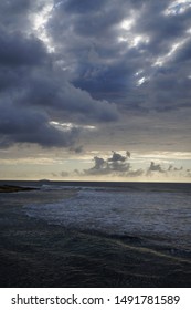  Sunset at the beach with dramatic clouds      