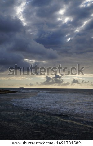  Sunset at the beach with dramatic clouds      