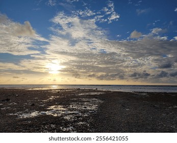 sunset Beach in the Maldives 
low tide exposed seaweed and part of the reef - Powered by Shutterstock