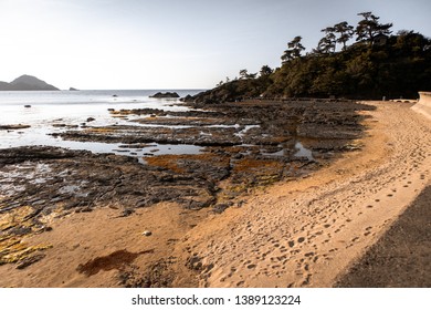 sunset at the beach with rocks