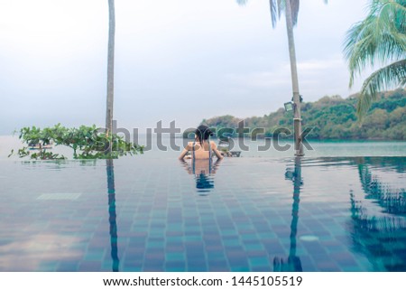 Similar – Rückansicht einer blonden Frau  im Infinity Pool