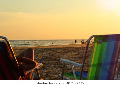 Sunset At The Beach, Two Chairs Facing The Ocean