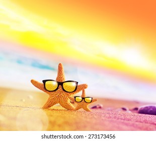 Sunset beach. Two starfish on sunglasses on the beach. - Powered by Shutterstock