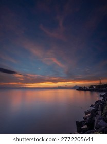 a sunset at beachfront city