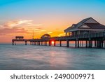 Sunset. Beautiful seascape with sunset. Fishing pier. Summer vacations. Clearwater Beach Florida Pier 60. Ocean or Gulf of Mexico beach. Florida paradise. Tropical nature. Good for travel agency