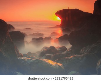 Sunset Behind the Beach Rocks